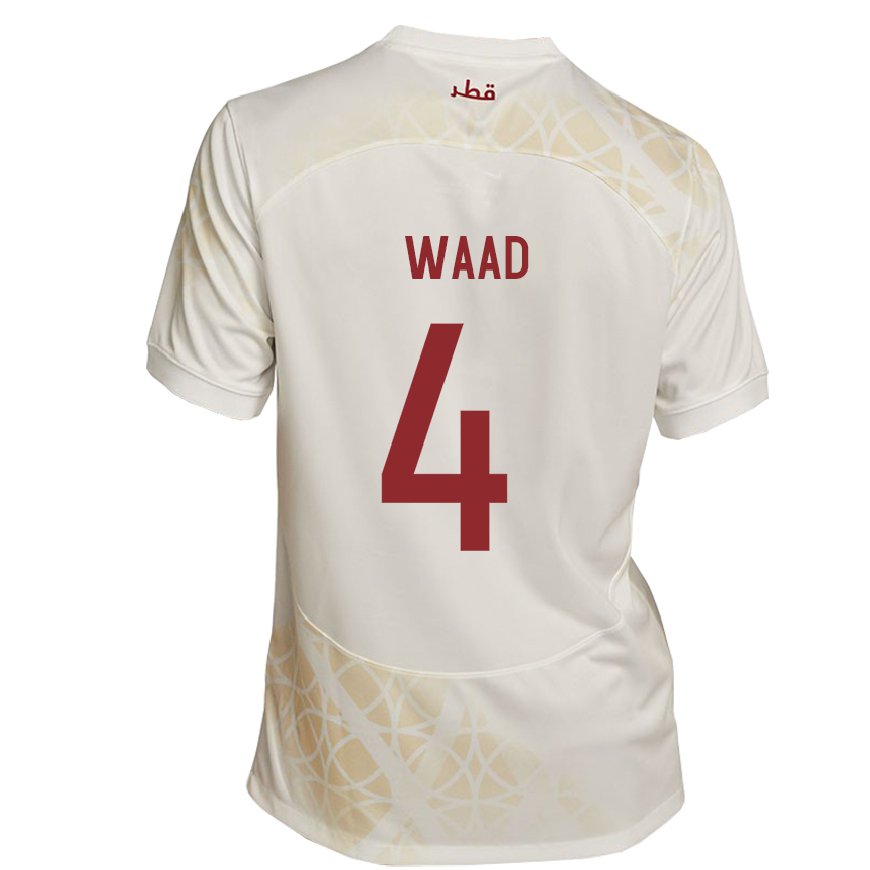 Kandiny Enfant Maillot Qatar Mohammed Waad #4 Beige Doré Tenues Extérieur 22-24 T-shirt