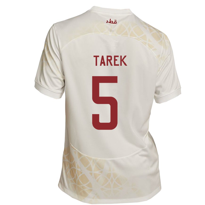 Kandiny Enfant Maillot Qatar Tarek Salman #5 Beige Doré Tenues Extérieur 22-24 T-shirt